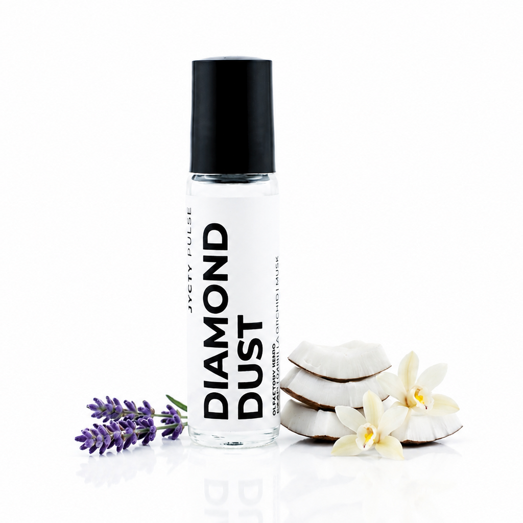 A clear cylindrical roller bottle labeled 'DIAMOND DUST' with a black cap, styled on a white background with lavender sprigs, white flowers, and sliced white fruit.