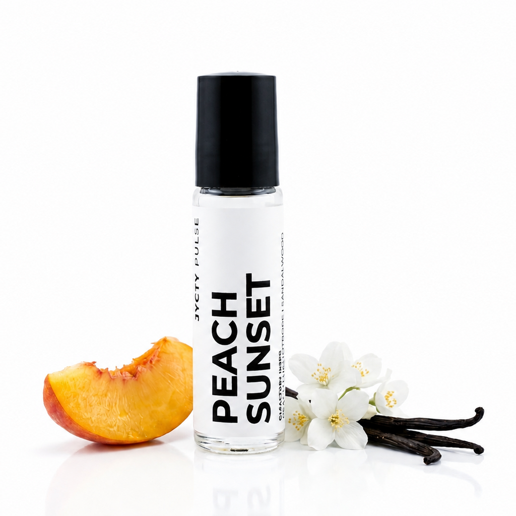 A clear roll-on bottle labeled 'PEACH SUNSET' with a black cap, styled on a white background with a peach slice, white flowers, and vanilla beans.