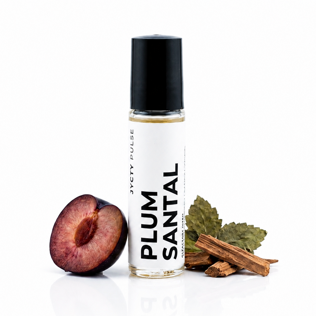 A clear cylindrical roller bottle with a black cap and a white label reading 'PLUM SANTAL' and 'JYCYT PULSE', shown on a white background with a halved plum, cinnamon sticks, and green leaves beside it.