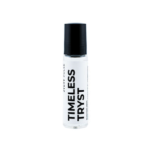 Small bottle with black cap and 'Timeless Tryst' text on a white background