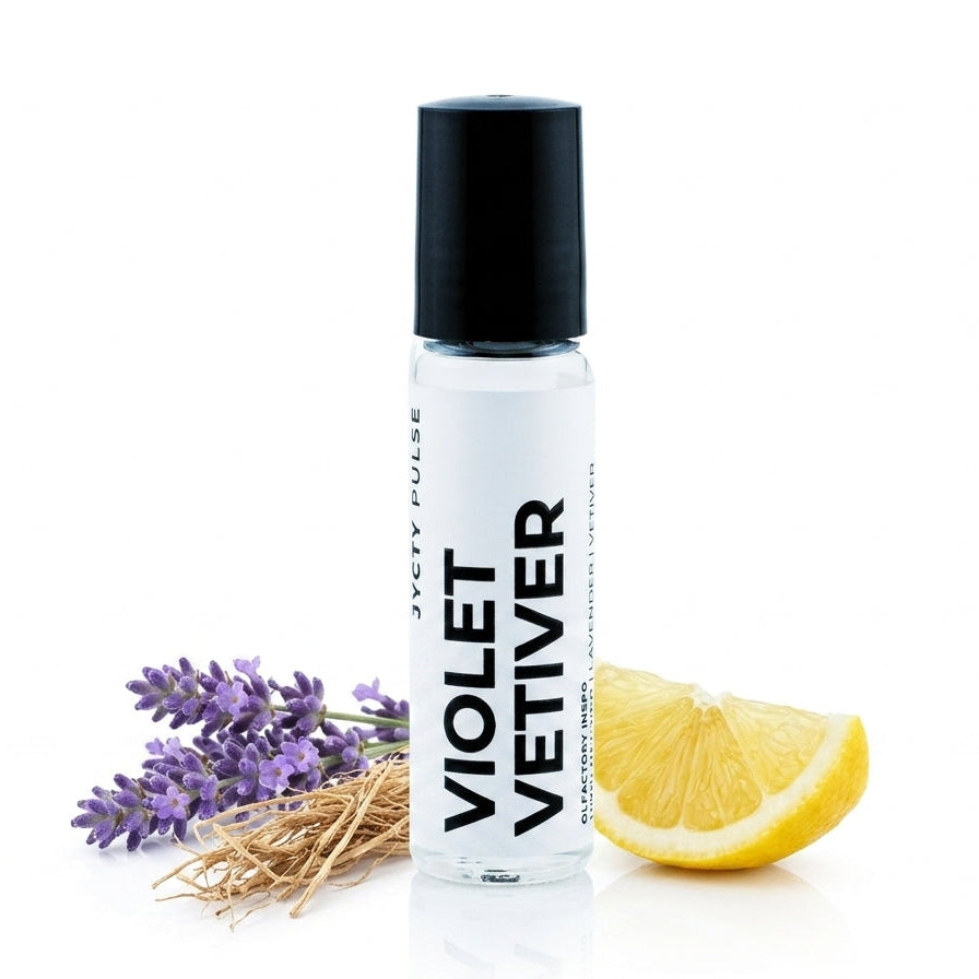 A clear cylindrical roller bottle with a black cap labeled 'VIOLET VETIVER' by JYCTY Pulse, styled with lavender sprigs and a lemon slice on a white background.